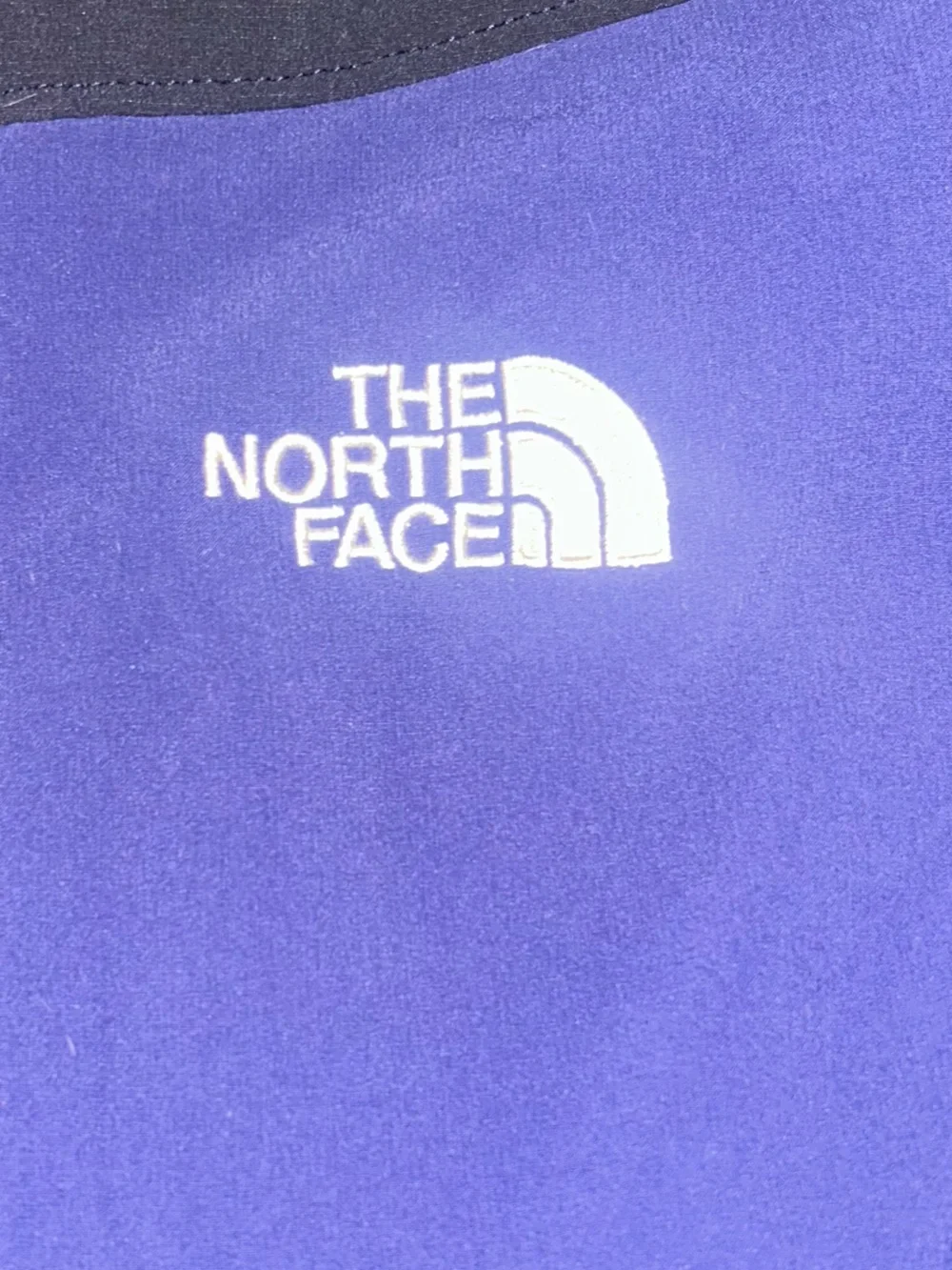 The North Face Men’s Blue and Black Softshell Jacket